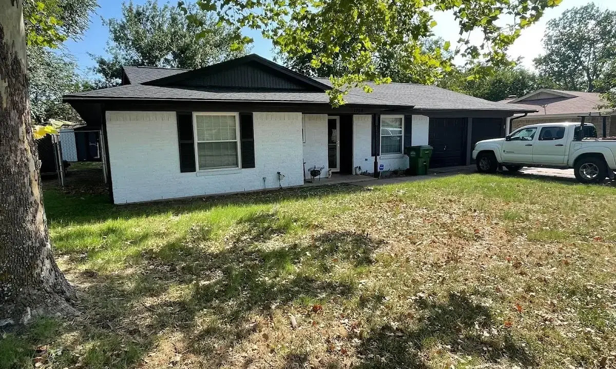 Professional roofing crew working on a residential roof in La Crosse